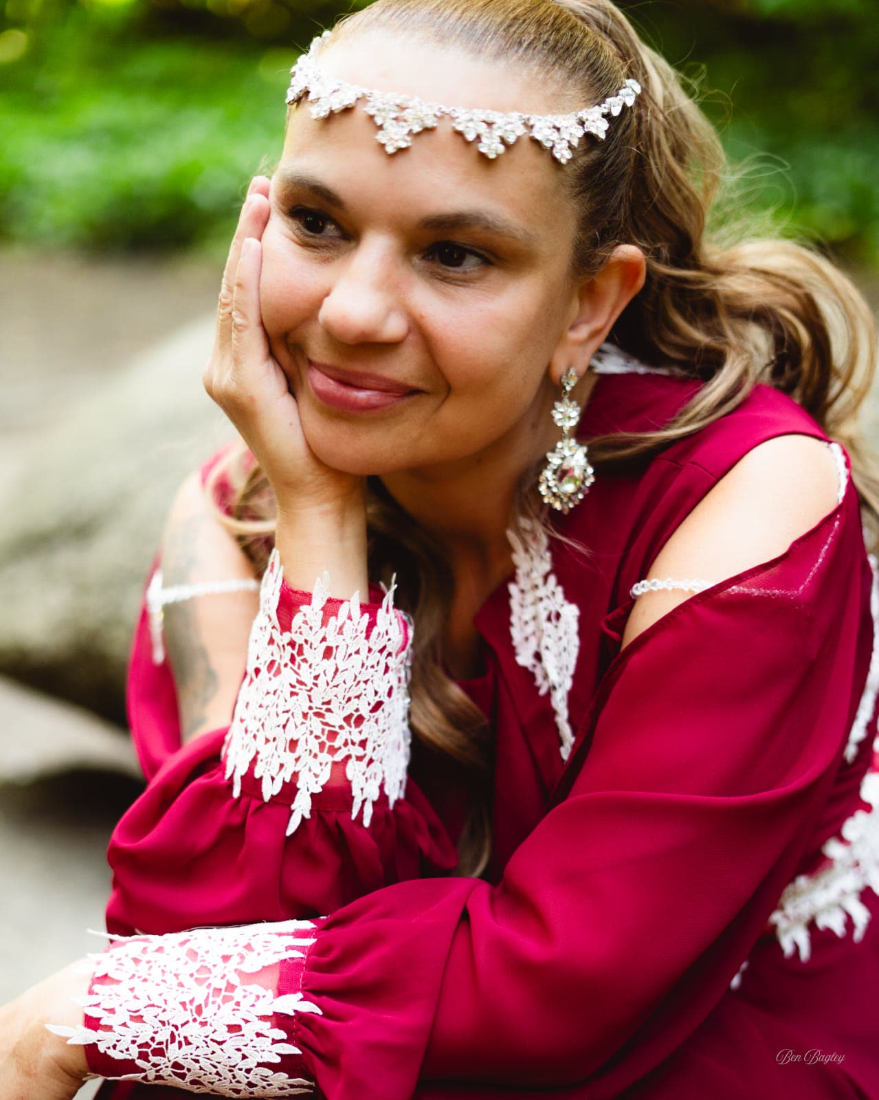 Close portrait of Aynaz smiling in crimson